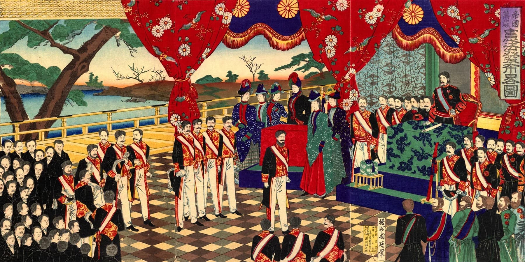 Colour woodblock triptych. Under red curtains with chrysanthemum crests, the emperor in Western military uniform stands on a dais beside a table holding the constitution scroll, facing ministers in gold-braided court uniforms, court ladies in Western gowns and, at the right, foreign diplomats.