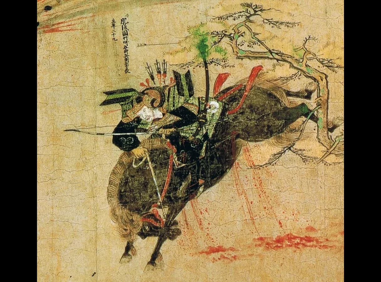 Scroll painting of a mounted Japanese warrior in armour with a bow, his horse wounded and bleeding, riding through flying arrows while a bomb bursts in flames at the top left.