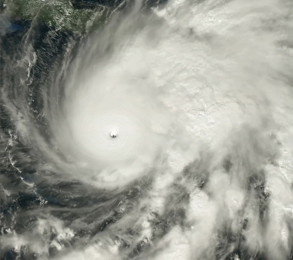 True-colour satellite image of Hurricane Melissa near landfall on Jamaica, 28 October 2025: a tight, clear eye surrounded by a dense, circular cloud mass with spiral bands extending hundreds of kilometres.