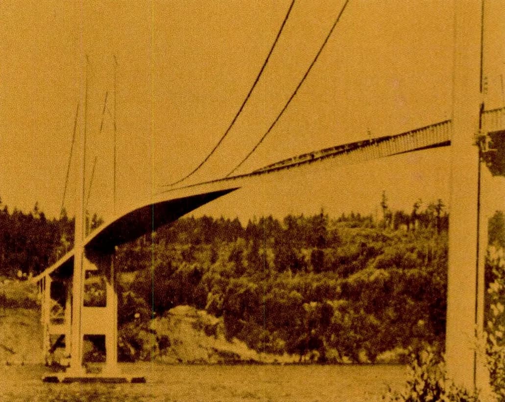 The 1940 Tacoma Narrows Bridge with its deck twisting: one side of the roadway is raised and the other lowered, about an hour before the collapse.