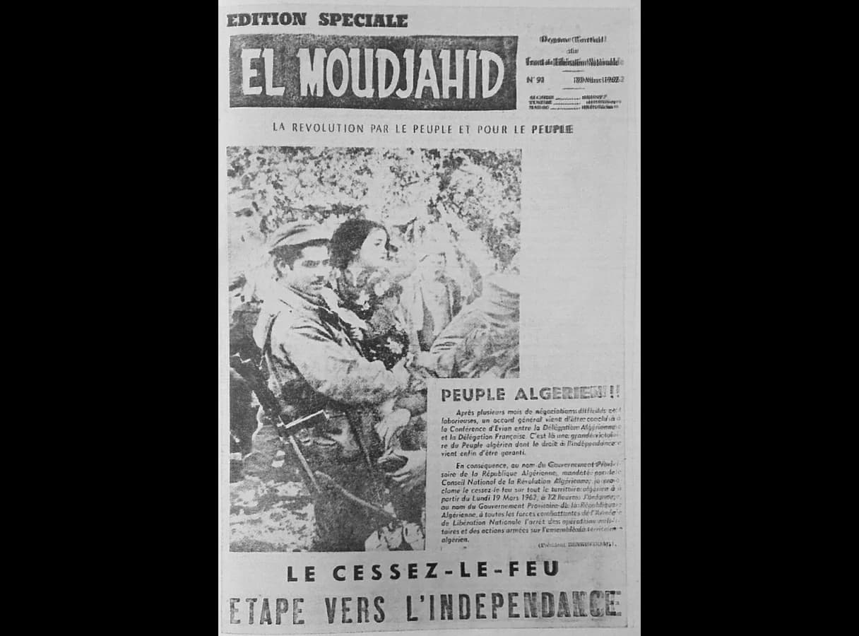 Front page of the newspaper El Moudjahid, special edition no. 91, 19 March 1962: a photograph of a smiling FLN fighter with a rifle among villagers, a proclamation headed Peuple algérien, and the headline “Cessez-le-feu” (ceasefire) and the line “Étape vers l’indépendance” (a step towards…